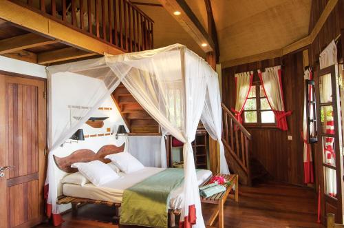 Ένα ή περισσότερα κρεβάτια σε δωμάτιο στο Princesse Bora Lodge & Spa