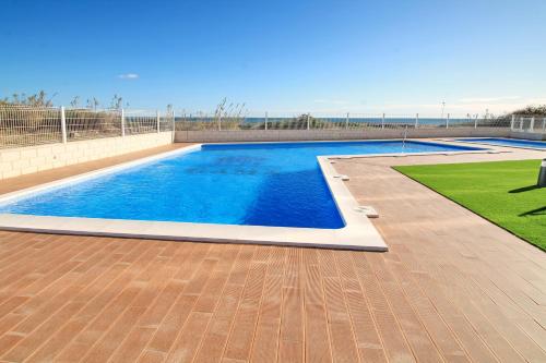a swimming pool in the middle of a yard at Alex Sun in La Mata