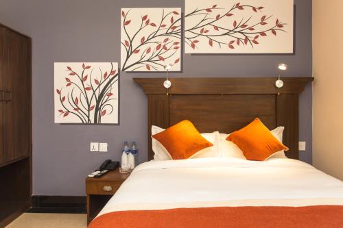 En eller flere senge i et værelse på Hotel Beijing Lu