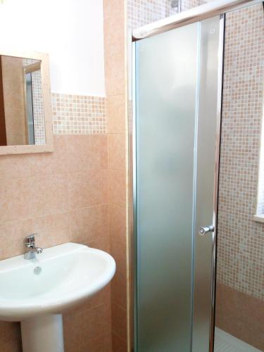 a bathroom with a shower and a sink at Vittoria Resort Residence-B&B in Galatina