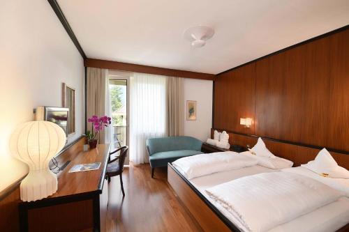 Postel nebo postele na pokoji v ubytování Hotel Juliane