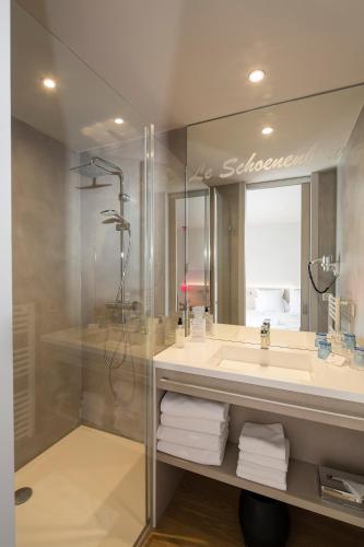 a bathroom with a sink and a shower at Best Western Plus Hotel & SPA Le Schoenenbourg in Riquewihr