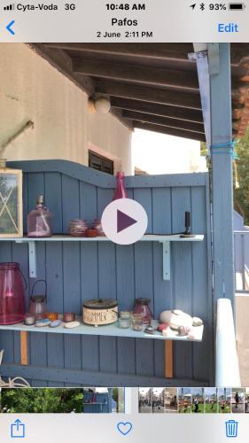 a blue shelf with pots and pans on it at Paphos gardens studio suite in Paphos City