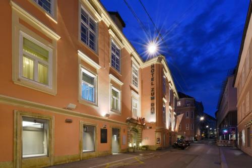 an empty street in a city at night at Boutique Hotel Dom - Rooms & Suites in Graz