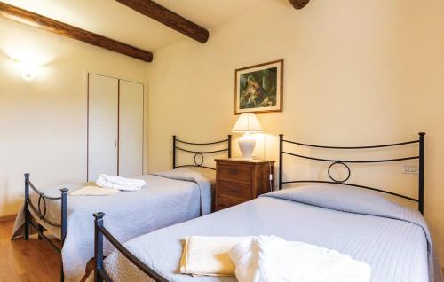 Postel nebo postele na pokoji v ubytování Agriturismo Il Castelluccio