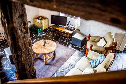 an overhead view of a living room with a table and chairs at La Retirée in Grimbiémont