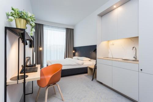 Кровать или кровати в номере Platinum Hotel&Residence Wilanów