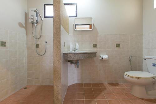 a bathroom with a shower and a toilet and a sink at Thongtakian Resort in Lamai