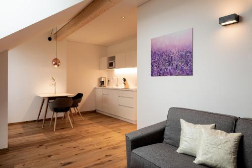 a living room with a couch and a table at Mederle Hof in Appiano sulla Strada del Vino