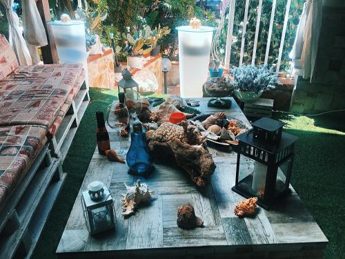 a table with some figurines on top of it at Villa oasi in Fontane Bianche