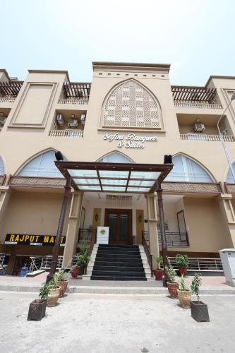 a building with a staircase leading to a door at Safari Club 4 in Rawalpindi