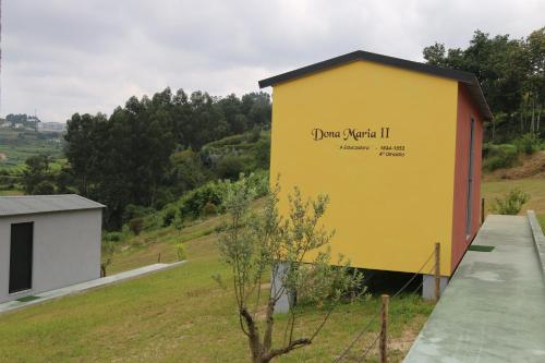 a yellow building with the words plant your ivil ii on it at Quinta da Costa in Lixa