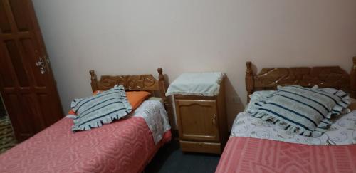 Katil atau katil-katil dalam bilik di Hotel Santusa