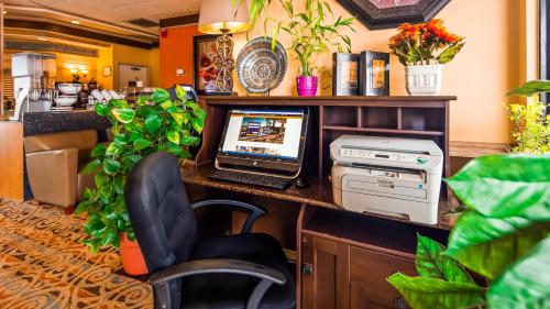 an office with a desk with a computer on it at Quality Inn & Suites Fayetteville I-95 in Fayetteville