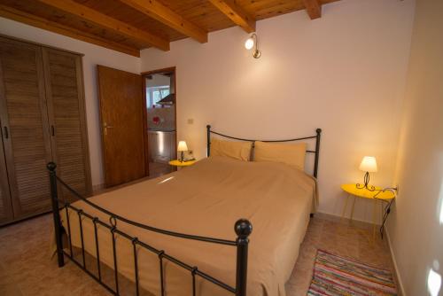 מיטה או מיטות בחדר ב-Rialto