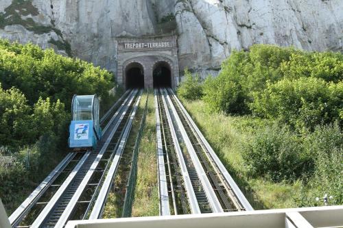 a train going into a tunnel in a mountain at Hotel Royal Albion in Mesnil-Val-Plage