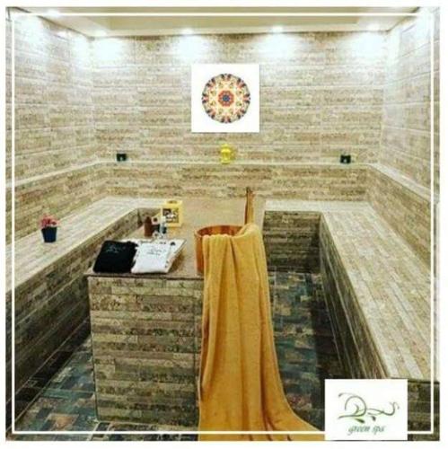 a bathroom with a tub with a towel on it at Elite Residence Aqua Park in Ain Sokhna