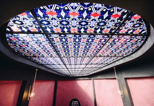 a ceiling with a heart shaped light in a room at King Gorgasali in Tbilisi City