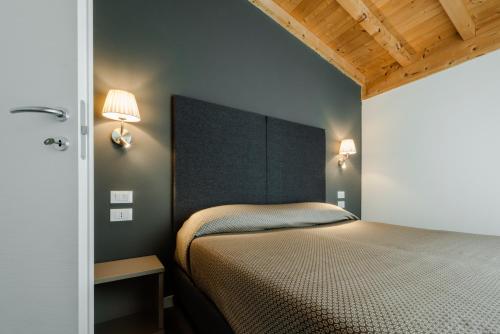 Кровать или кровати в номере Garda Guest House