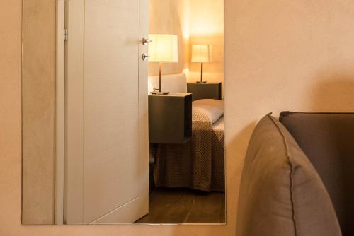Katil atau katil-katil dalam bilik di Lazise Boutique Apartment Lago e Relax