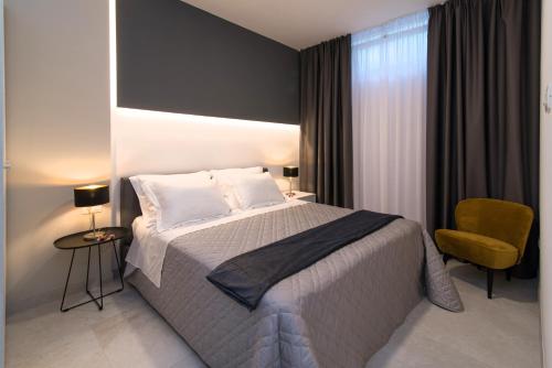 Posteľ alebo postele v izbe v ubytovaní CURICTA Design Apartments