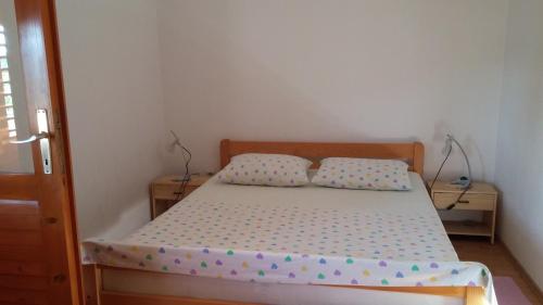 Postel nebo postele na pokoji v ubytování Apartman Joso