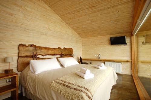 Cama o camas de una habitación en Hotel & Cafe Veliche