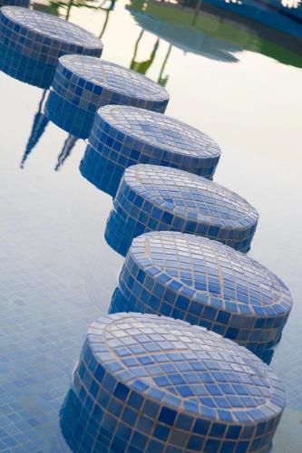 a row of blue steps in the water at Hotel Mariant in S'Illot