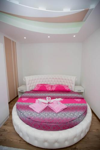 Postel nebo postele na pokoji v ubytování Apartmani Slađo