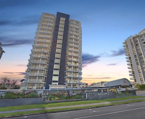 a large building with a view of a city at Catalina Resort in Maroochydore