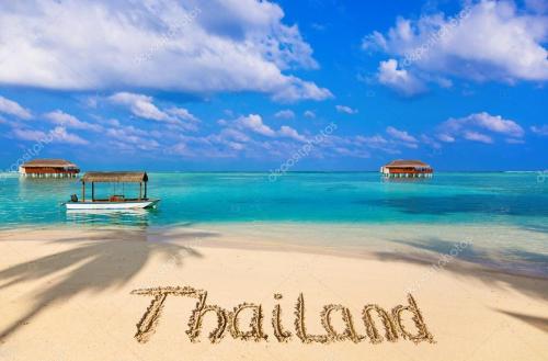 word vacation written on the beach stock photo at Chill land house in Bang Tao Beach