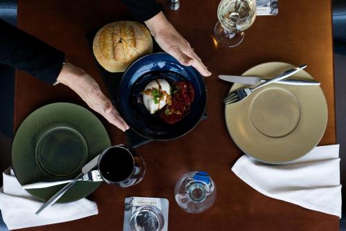 a table with a bowl of food and a plate of food at Hyatt Regency Orlando International Airport Hotel in Orlando