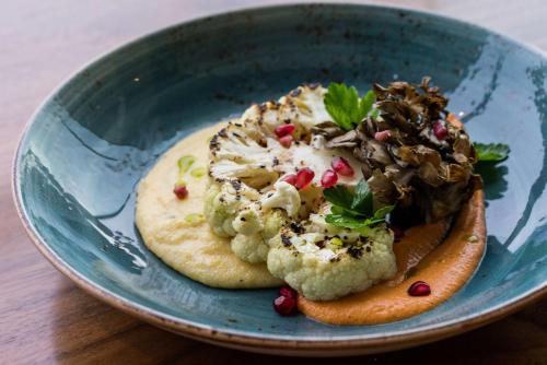 a blue bowl with a plate of food on a table at Hyatt Regency Orlando International Airport Hotel in Orlando