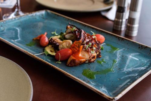 a blue plate of food on a table at Hyatt Regency Orlando International Airport Hotel in Orlando
