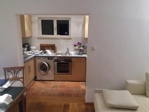 a small kitchen with a sink and a dishwasher at Ferienhaus Baederleiblick in Bad Ems
