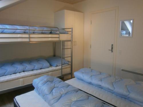 Un ou plusieurs lits superposés dans un hébergement de l'établissement Vedersø Klit Camping & Cottages