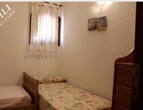 Postelja oz. postelje v sobi nastanitve Villa Turisarda
