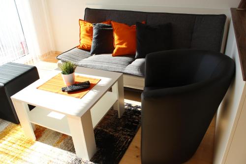 Un lugar para sentarse en Familienapartment Sunnseitn