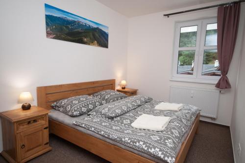 Postel nebo postele na pokoji v ubytování Apartmány Biela Púť - Jasná nr. 8