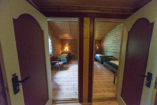 an open door to a hallway with a living room at Dombås Hostel in Dombås