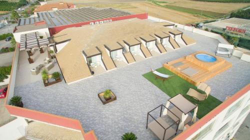an overhead view of a building with a swimming pool at Attico in Canicattì