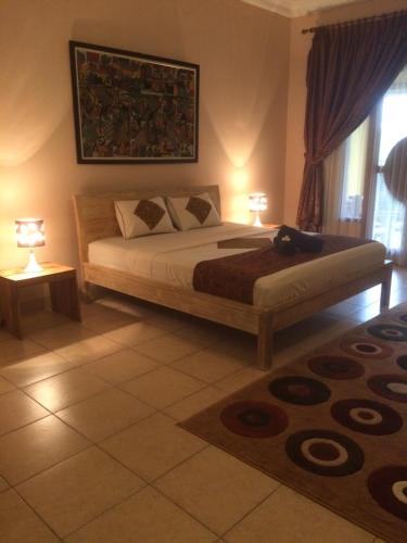 Ένα ή περισσότερα κρεβάτια σε δωμάτιο στο Ada Waktu Homestay