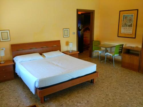 Postel nebo postele na pokoji v ubytování B&B Il Parco Dei Pini