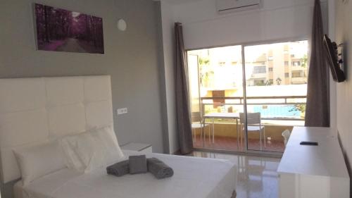 Postel nebo postele na pokoji v ubytování Hotel Carlos I