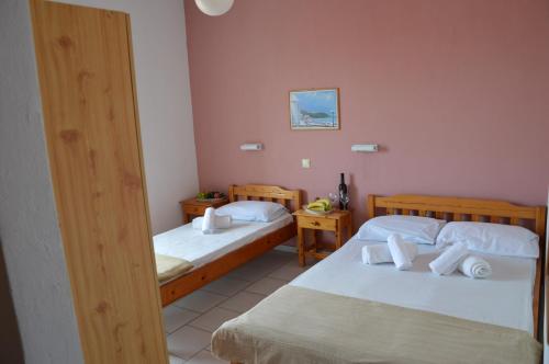 a room with two beds in a room at Asteri's Summer in Paralia Katerinis