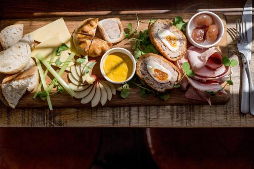 a tray of food with eggs and bread and cheese at Orange Tree in Richmond upon Thames