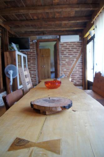 a wooden table with a bowl on top of it at Guest House Glogovac in Kamenica