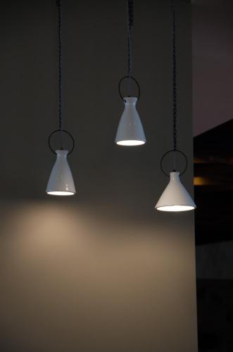 three lights hanging from the ceiling in a room at Rodon Hotel and Resort in Agros