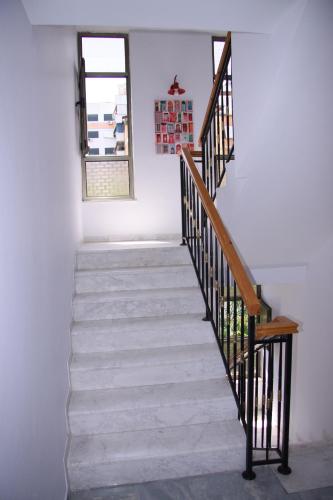 a staircase in a house with a window at ART Hostel in Tirana