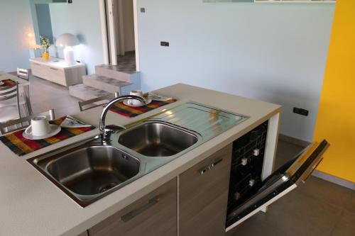 a kitchen with a sink and a counter top at B&B A CASA DI ZIA LUISA in Venticano